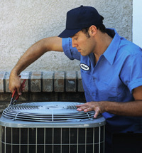 A technician working on an air conditioner
