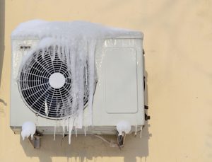 An air conditioner covered in ice